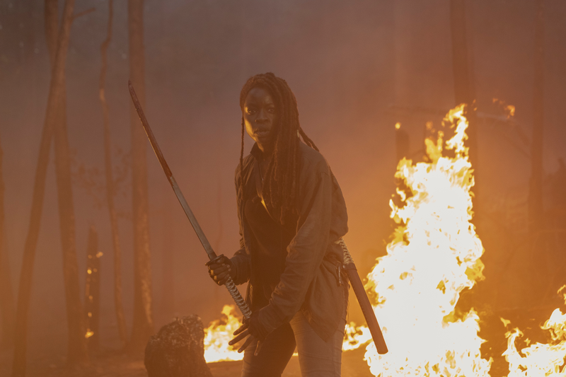 Michonne helps fight the fire by fighting zombies who are on fire.
